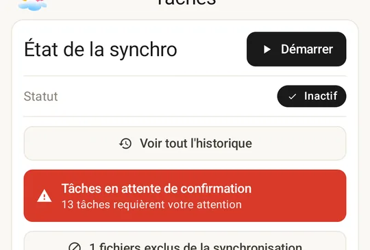 Sync Status card with the awaiting-confirmation alert: tasks have been parked for review instead of running automatically.